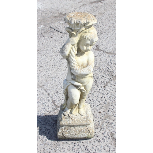 315 - Large stone garden statue of a cherub, approx 80cm tall