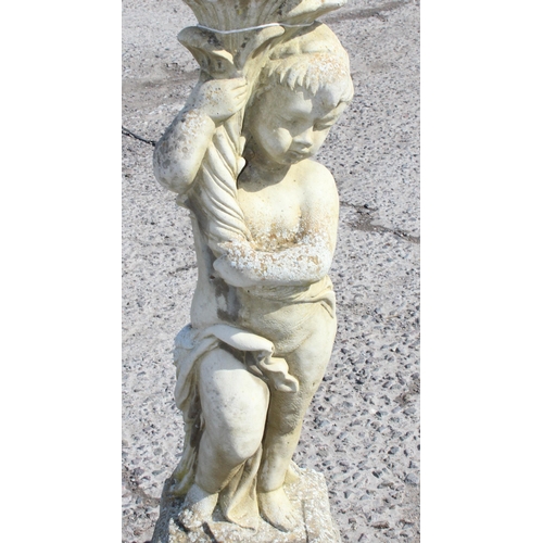 315 - Large stone garden statue of a cherub, approx 80cm tall