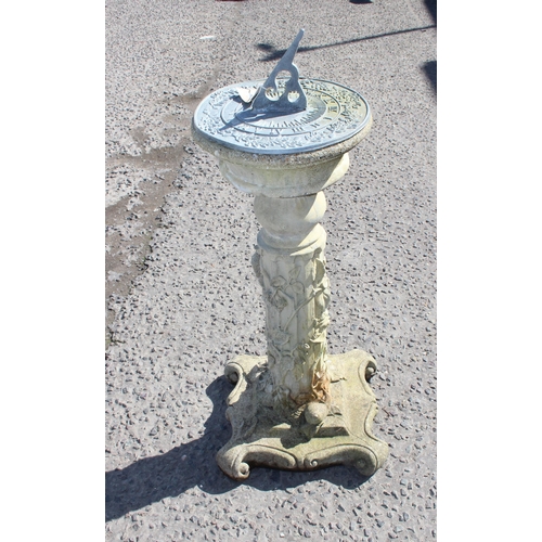 316 - Cast stone sundial on plinth with climbing leaves and woodland decoration, approx 75cm tall