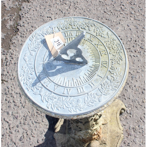 316 - Cast stone sundial on plinth with climbing leaves and woodland decoration, approx 75cm tall