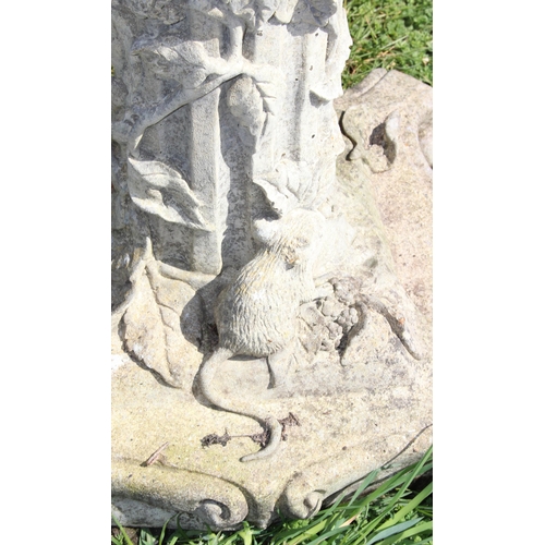 316 - Cast stone sundial on plinth with climbing leaves and woodland decoration, approx 75cm tall