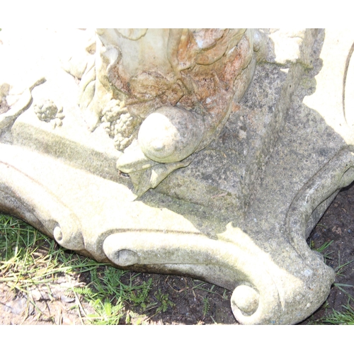 316 - Cast stone sundial on plinth with climbing leaves and woodland decoration, approx 75cm tall