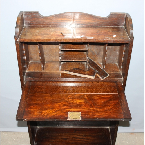 74 - An early 20th century oak student's bureau approx 60cm wide and a vintage Art Deco period oak bookca... 