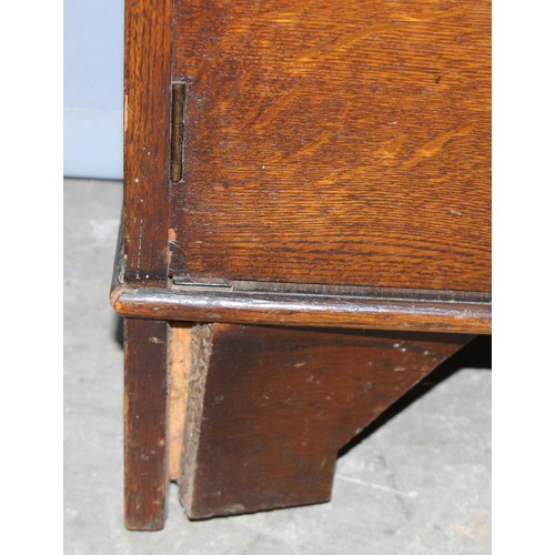 74 - An early 20th century oak student's bureau approx 60cm wide and a vintage Art Deco period oak bookca... 