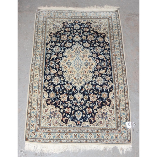 210 - An extremely finely woven Persian Isfahan rug of cream and blue ground, possibly silk, 20th century,... 