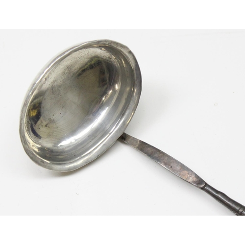 1016 - An early 19th century silver toddy ladle with twisted whalebone handle, unmarked but XRF tested as s... 