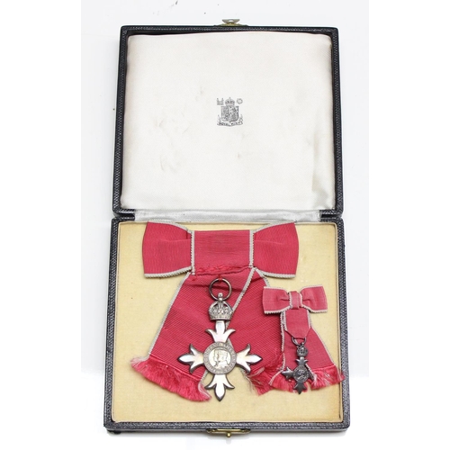 1405 - A Ladies Civilian MBE in a Royal Mint case of issue, complete with ribbon in bow form and a matching... 