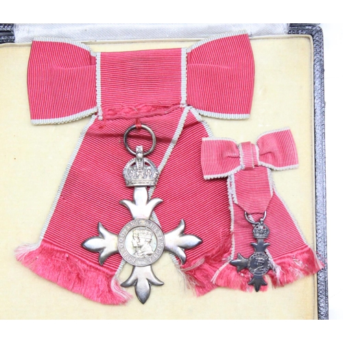 1405 - A Ladies Civilian MBE in a Royal Mint case of issue, complete with ribbon in bow form and a matching... 