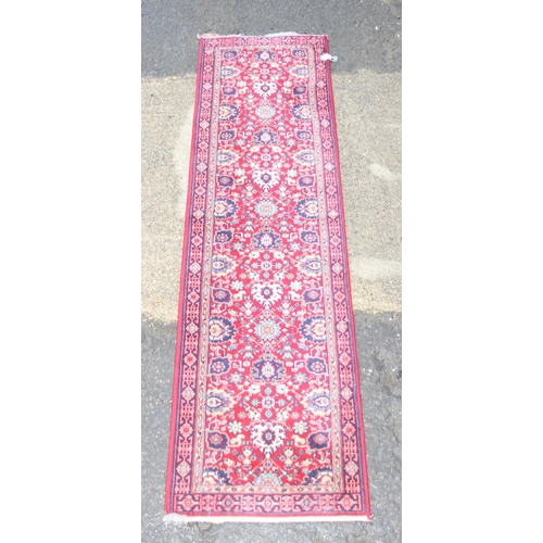 213 - A vintage red ground Basra runner rug, approx 240cm x 66cm