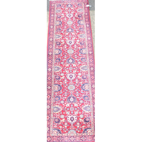 213 - A vintage red ground Basra runner rug, approx 240cm x 66cm