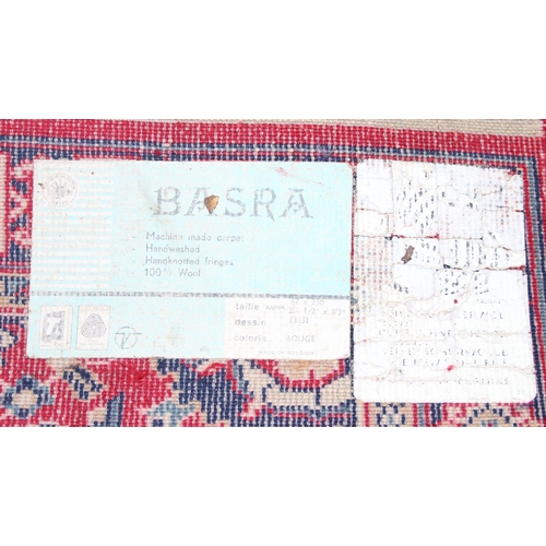 213 - A vintage red ground Basra runner rug, approx 240cm x 66cm