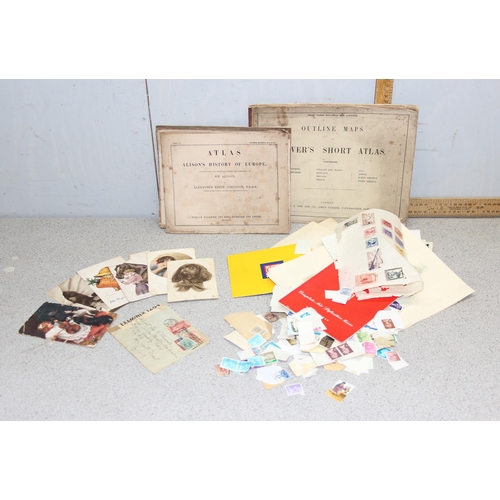 562 - Qty of WW1 dated written postcards, Qty of loose stamps and 2 vintage paperback atlas's