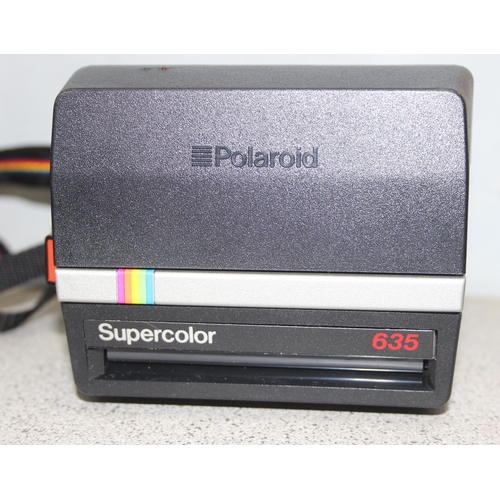 711 - 3 assorted polaroid cameras to include a Polariod SX-70 land camera model 2 and a Supercolour 635