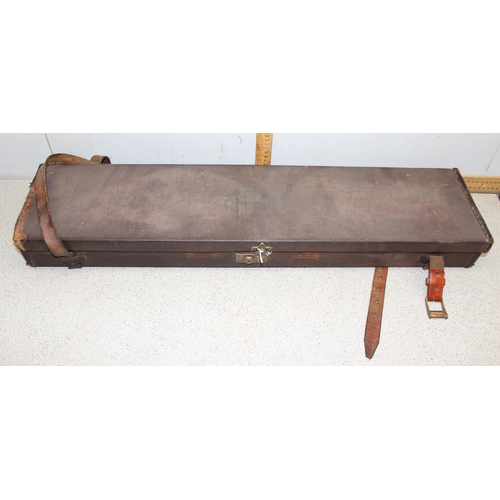 766 - Brown canvas unmarked gun case with a green felt lined interior