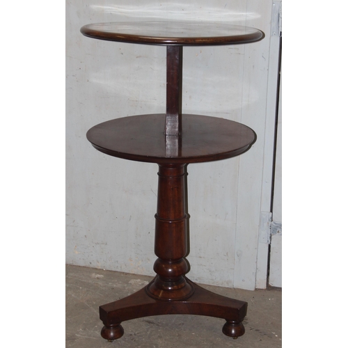 150 - A 19th century mahogany 2 tier dumb waiter table on platform base, approx 61cm in diameter and 109cm... 