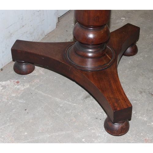 150 - A 19th century mahogany 2 tier dumb waiter table on platform base, approx 61cm in diameter and 109cm... 