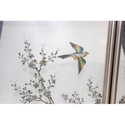 465 - An interesting pair of vintage mirrors with hand painted scenes of birds on branches, in silver colo... 