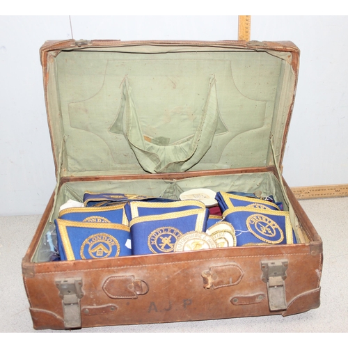 1417 - A vintage leather suitcase containing a large qty of assorted masonic regalia, to inc aprons, cuffs ... 