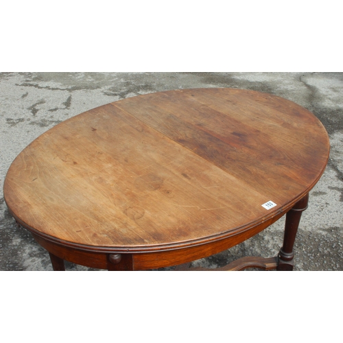 153 - An antique French oval table with extending leaf, approx 122cm wide