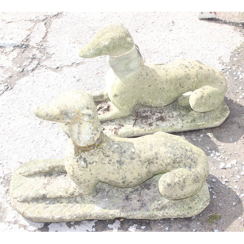 300 - A large pair of weathered concrete garden greyhound figures, approx 76cm wide