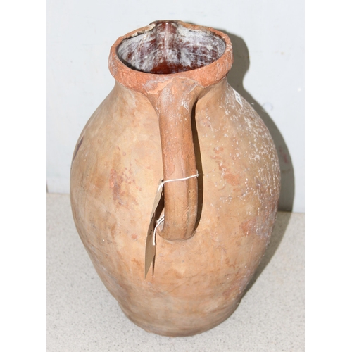 336 - A large antique terracotta jug, likely 19th century or earlier, approx 35cm tall