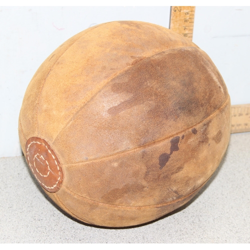 772 - A vintage leather medicine ball, approx 30cm in diameter