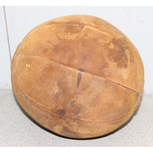 772 - A vintage leather medicine ball, approx 30cm in diameter