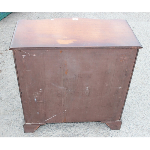 14 - A Georgian style Mahogany serpentine 4 drawer chest of drawers, with oak lined drawers and brass lio... 