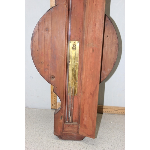 1314 - A 19th century mahogany cased wheel barometer, the broken swan neck pediment above a hygrometer, the... 