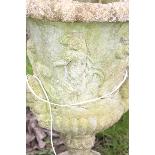 302 - A pair of weathered concrete garden pots, each approx 53cm tall