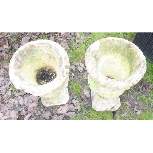 302 - A pair of weathered concrete garden pots, each approx 53cm tall