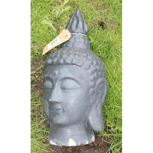 317 - 3 garden ornaments to include a Buddha head and a small stoneware flagon