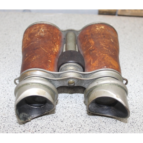 701 - 2 pairs of antique field glasses or binoculars, one pair possibly a WW1 private purchase pair