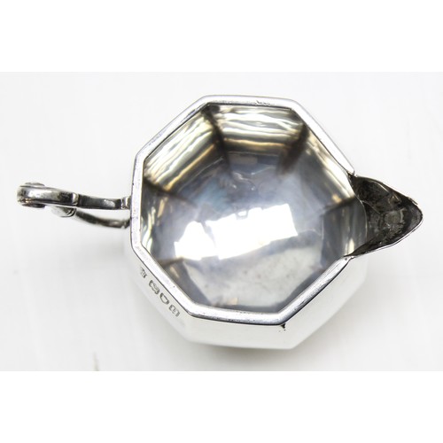 1014A - A small silver cream jug of octagonal form, London 1915 by Thomas Bradbury & Son, approx 73.66g gros... 