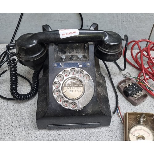 702 - Vintage Bakelite telephone model number 328L FWR67/2A and a vintage pocket voltmeter