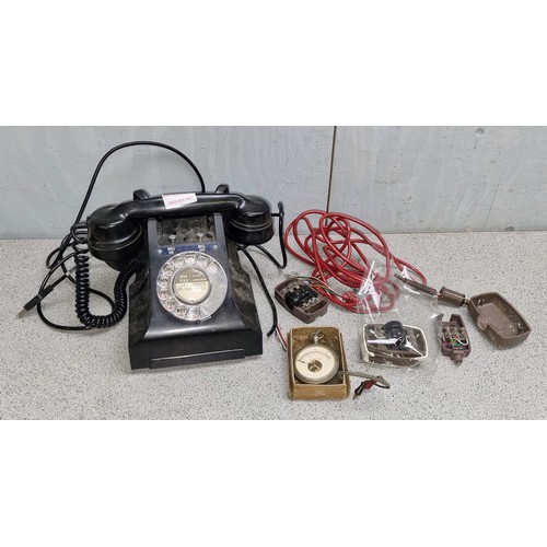 702 - Vintage Bakelite telephone model number 328L FWR67/2A and a vintage pocket voltmeter