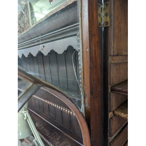 105 - Antique mahogany glazed bookcase over large shelved cupboard, approx 220cm