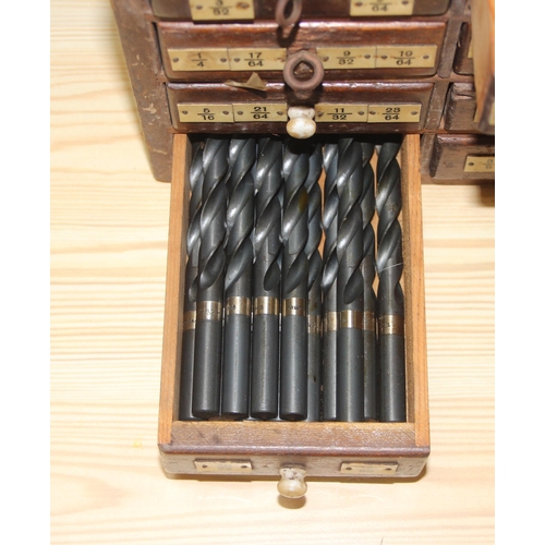 10 - A small early 20th century 8 drawer wooden engineers chest box currently holding drill bits, approx ... 