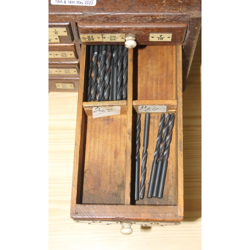 10 - A small early 20th century 8 drawer wooden engineers chest box currently holding drill bits, approx ... 