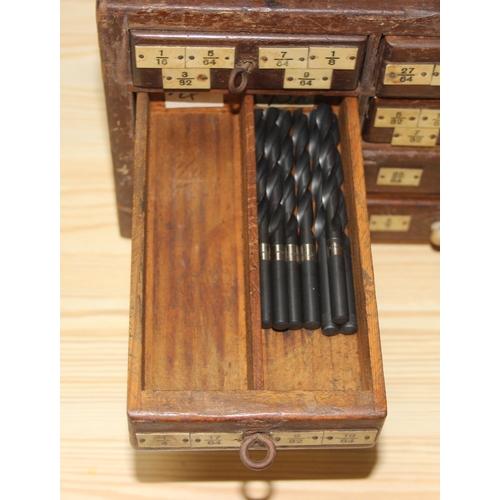 10 - A small early 20th century 8 drawer wooden engineers chest box currently holding drill bits, approx ... 