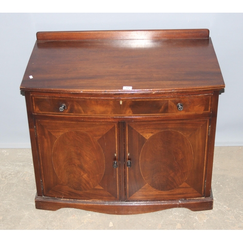 12 - An Edwardian mahogany hall cupboard or small sideboard formed as a single drawer over a cupboard bas... 