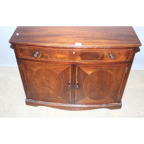 12 - An Edwardian mahogany hall cupboard or small sideboard formed as a single drawer over a cupboard bas... 