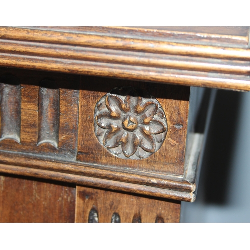 17 - An early 20th century bookcase or hall cupboard with 3 shelves, carved details and original key, app... 