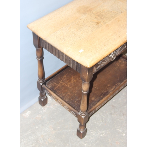 19 - An Ercol or Old Charm oak console table with 2 drawers, approx 69cm wide