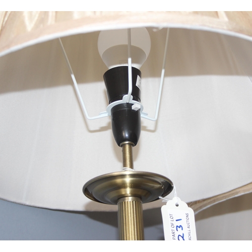 231 - A set of 3 brass effect standard lamps with shades