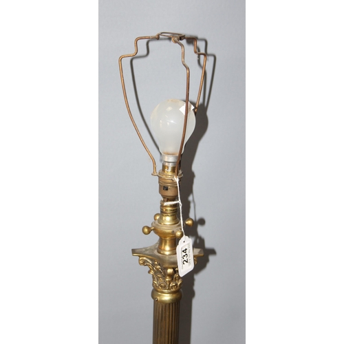 234 - A heavy vintage brass column standard lamp, approx 140cm tall