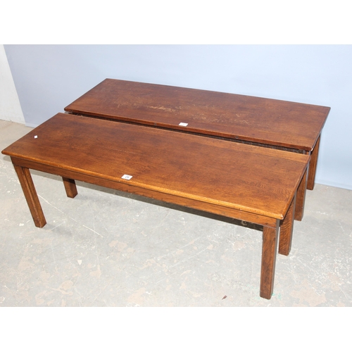 24 - An unusual pair of early 20th century oak low tables, each one forming one half of a square or for u... 