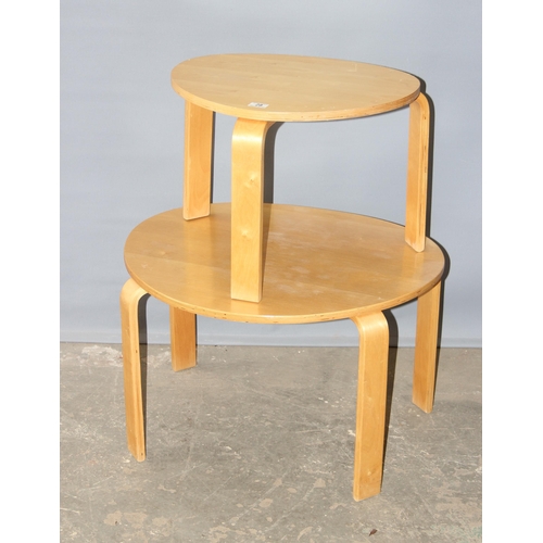 28 - A nest of 2 retro style bentwood tables, largest approx 74cm wide