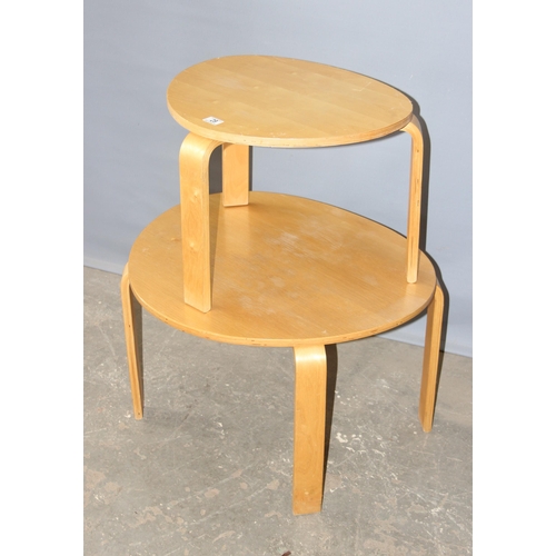 28 - A nest of 2 retro style bentwood tables, largest approx 74cm wide