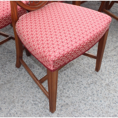 30 - A set of 10 19th century shield backed mahogany dining chairs (2 carver & 8 dining), with patterned ... 